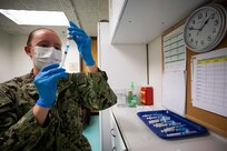 Navy Lt. Courtney Corcoran prepares COVID-19 vaccine syringes in support of COVID-19 vaccine operations. U.S. Northern Command, through U.S. Army North, remains committed to providing flexible Department of Defense support to the whole-of-government COVID-19 response.