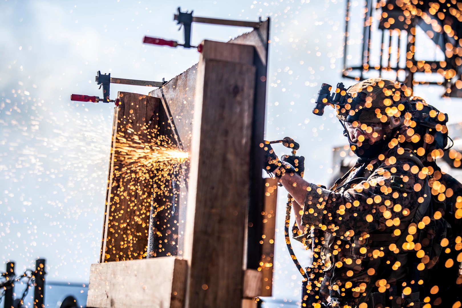 Force Reconnaissance Marine with Command Element, 31st Marine Expeditionary Unit, performs simulated breach utilizing welding torch during visit, board, search, and seizure exercise aboard USS Germantown, South China Sea, September 6, 2020 (U.S. Navy/Taylor DiMartino)