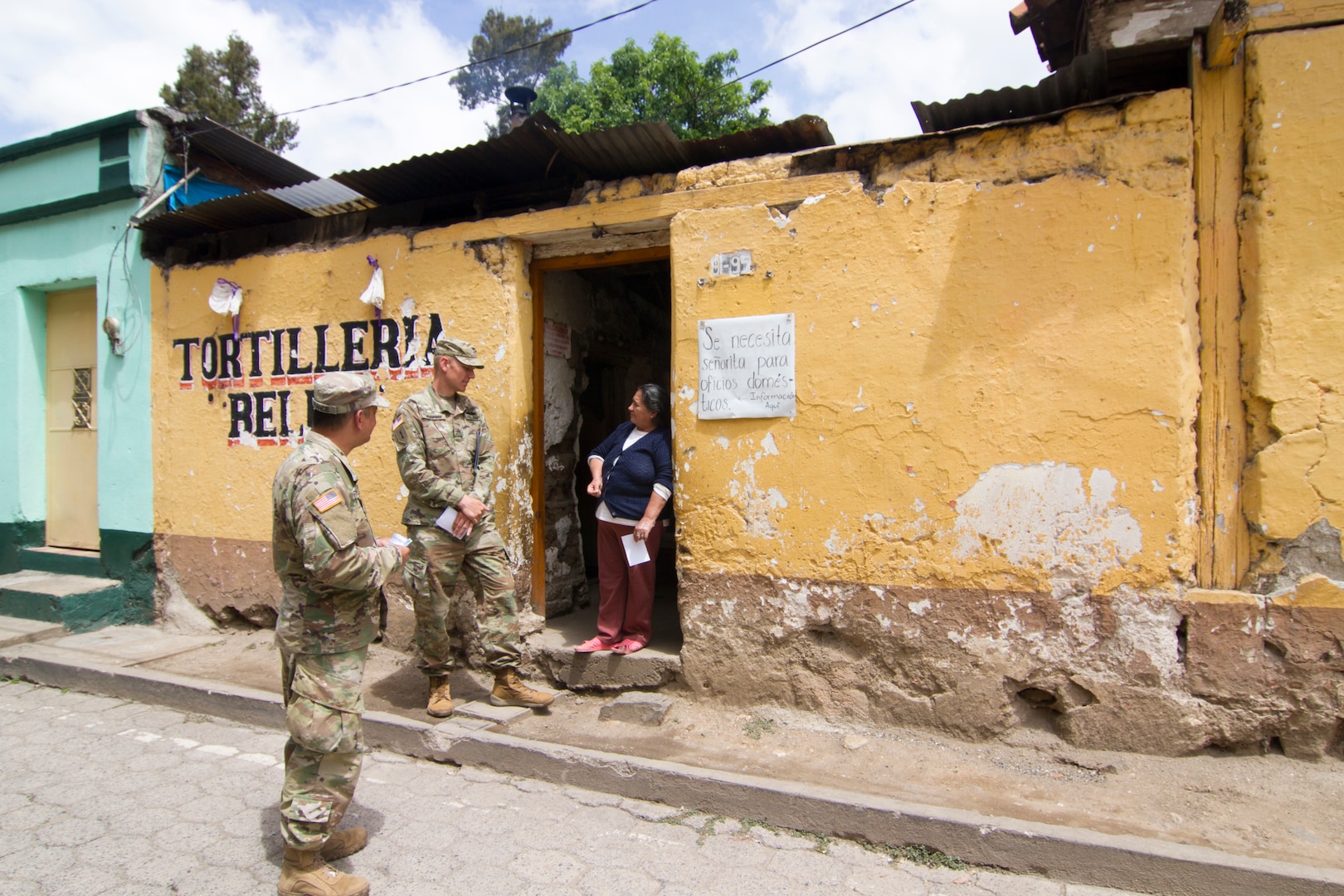 Soldiers present flyers promoting free medical event to local citizens of Chilanta, Guatemala, during Beyond the Horizon 2019 (U.S. Army Reserve/Olha Vandergriff)