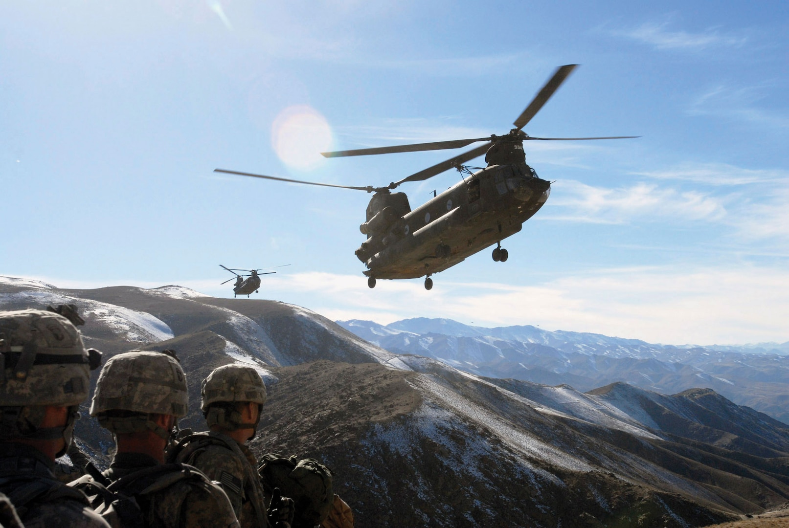 Soldiers with 101st Division Special Troops Battalion, 101st Airborne Division, watch as two Chinook helicopters fly in to return them to Bagram Airfield, Afghanistan, November 4, 2008 (U.S. Army/Mary L. Gonzalez)