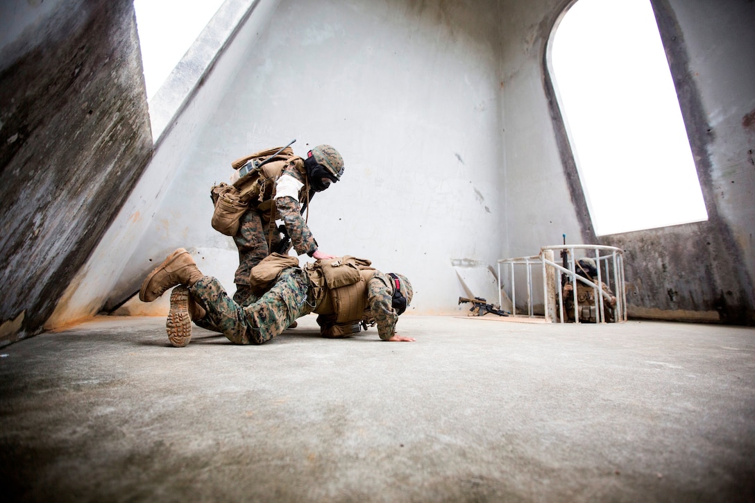 Marine with Weapons Company, Battalion Landing Team 2nd Battalion, 5th Marine Regiment, 31st Marine Expeditionary Unit, captures member of opposing force during urban combat training in Okinawa, Japan, February 8, 2014 (U.S. Marine Corps/Andrew Kuppers)