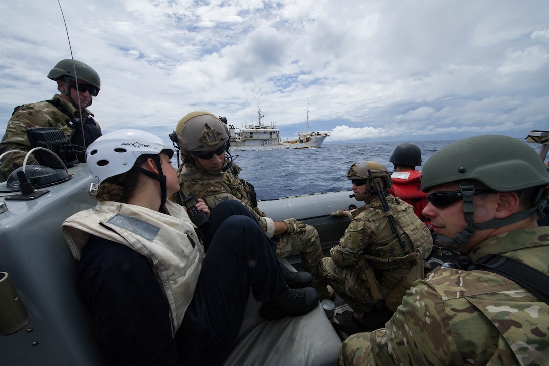 Sailors and Coast Guard Pacific Law Enforcement Detachment Team personnel approach Chinese fishing vessel during Oceania Maritime Security Initiative mission with USS Sampson, Pacific Ocean, November 29, 2016 (U.S. Navy/Bryan Jackson)