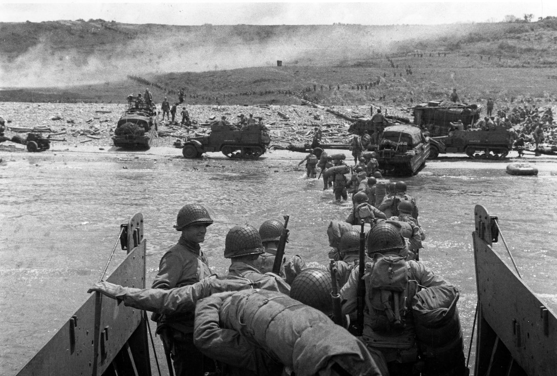 Troops wade ashore from LCVP landing craft, off Omaha Beach, June 6, 1944 (National Archives and Records Administration/U.S. Army Signal Corps Collection)