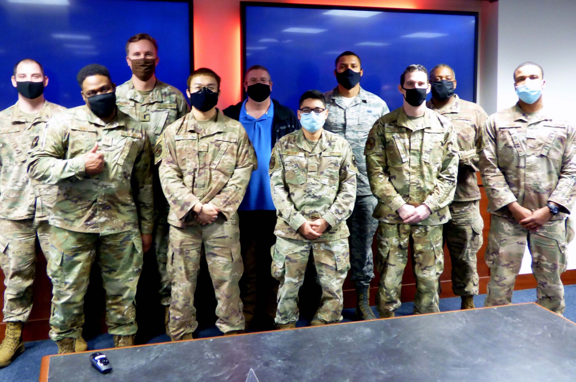 Air Force Special Operations Command Airmen pose for a photo after completing the command's Mission Defense Conference at Hurlburt Field, Fla., Feb. 5, 2021. The conference focused on identifying the organic cyber capabilities needed to protect missions against threats in, through, and from cyberspace. (U.S. Air Force photo by Senior Airman Brandon Esau)