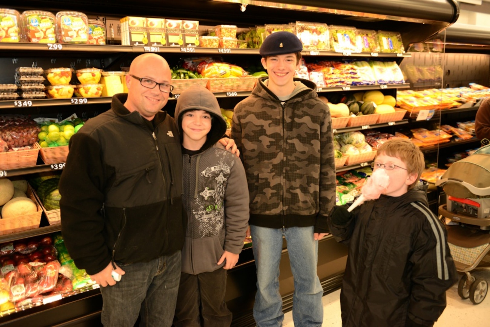 CAPE MAY, N.J. - Chief Petty Officer William Herr, chief of police for Training Center Cape May, and his sons browse the aisles of the new Coast Guard Market Place aboard the training center during a sneak peek for Coast Guard families Nov. 4, 2012. The new MarketPlace is a benefit for military service members, their families, authorized beneficiaries and military retirees. Coast Guard photo by Chief Warrant Officer Donnie Brzuska.