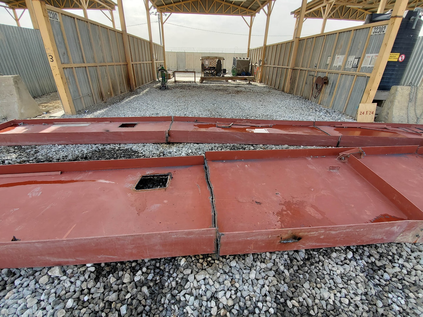 Huge pieces of building materials are reduced to more manageable sizes at a cutting bay at the DLA Disposition Services site at Bagram, Afghanistan.