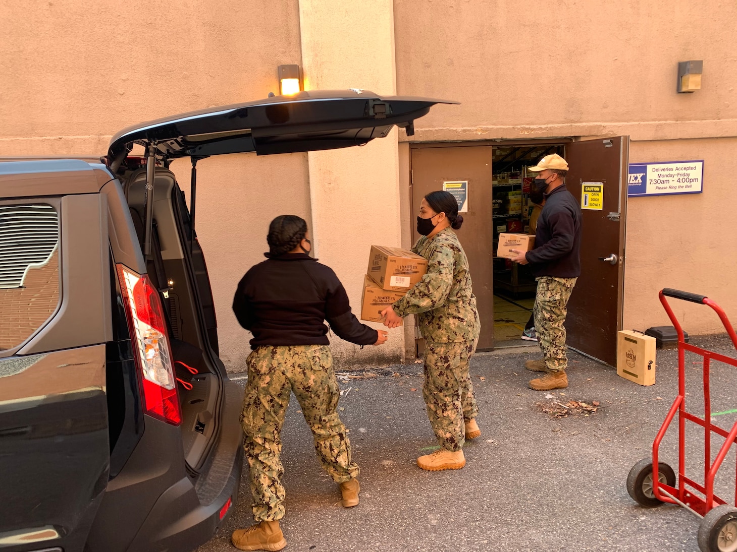 Reserve Sailors load boxes of Meals, Ready-to-Eat (MREs) for service members supporting the 59th Presidential Inauguration. The Navy Liaison Office secured $9,000 in MREs and water to nourish 224 Sailors supporting the inauguration.