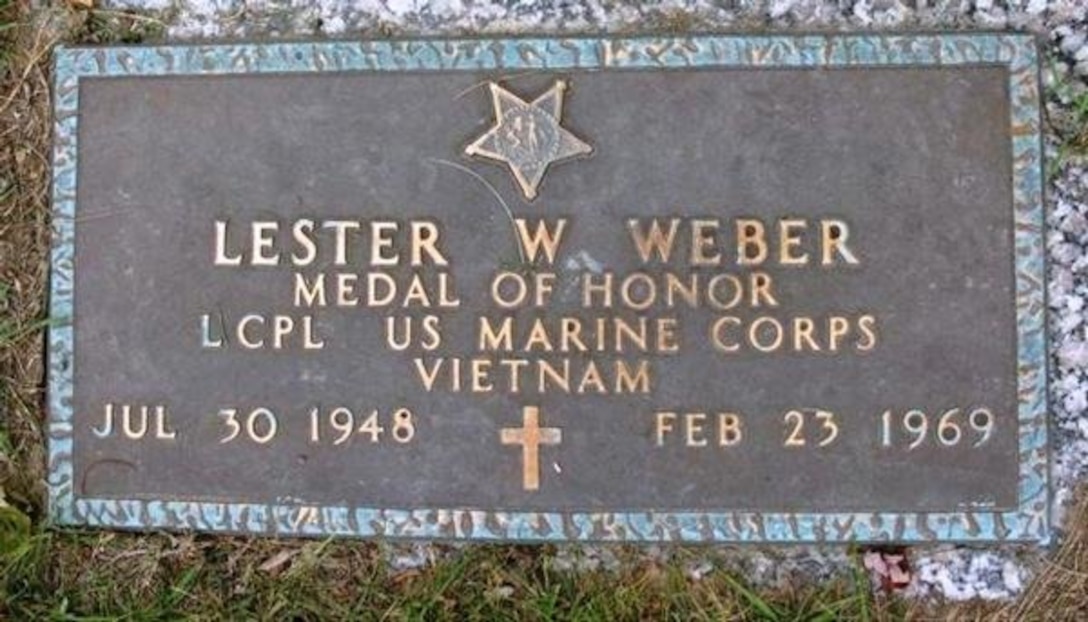 A grave marker provides information about a man named Lester W. Weber.