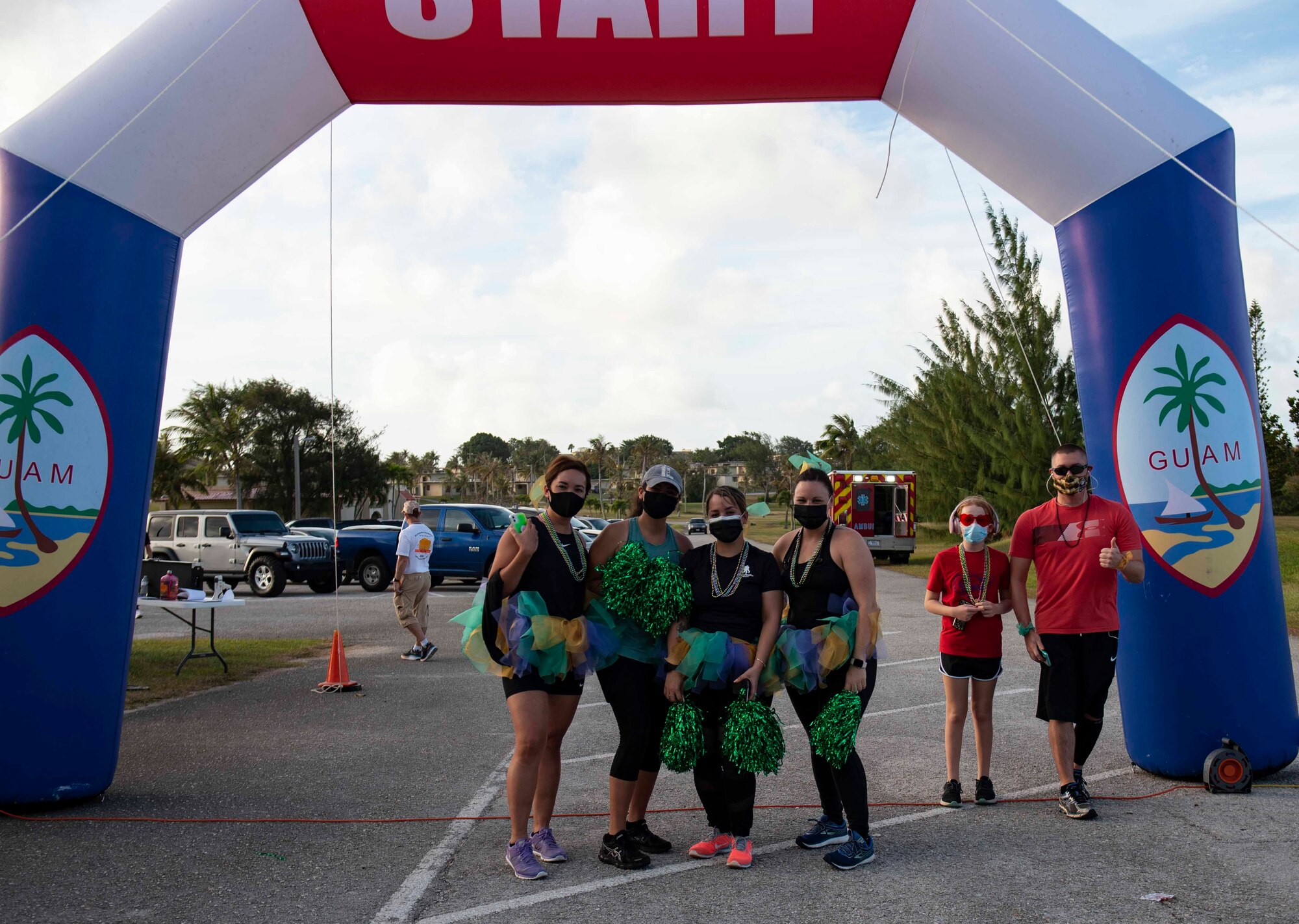 Participants pose for a picture before starting the first ever Fat Tuesday 5K fun run at Andersen Air Force Base, Guam, Feb. 16, 2021.