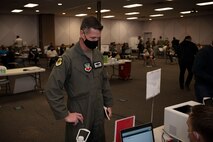 Airman checks in at vaccine counter