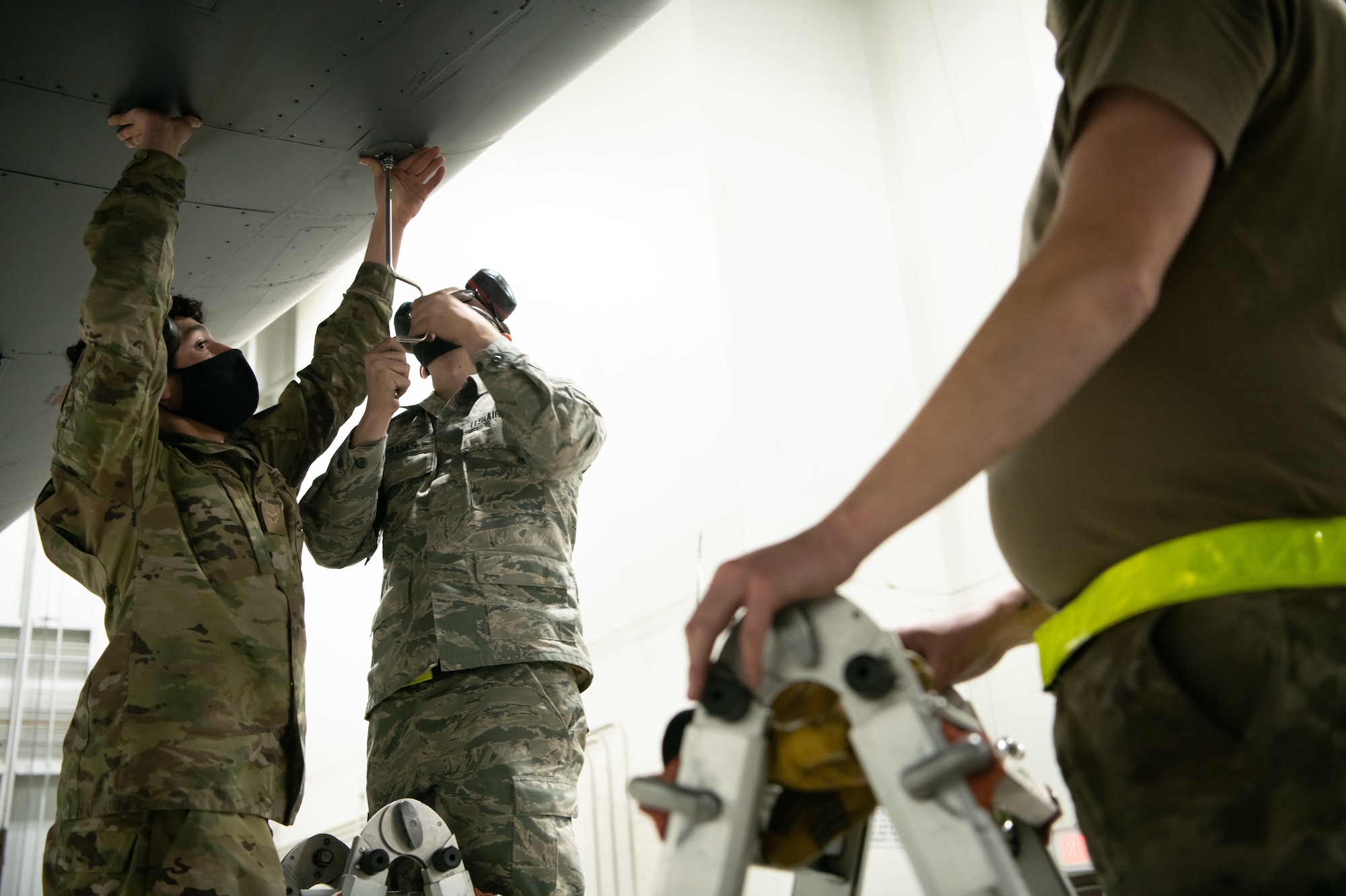 Airmen 1st Class Antonio Artiaga and Kane Eubanks, both from the 28th Aircraft Maintenance Squadron, prepare a B-1B Lancer for divestiture at Ellsworth Air Force Base, S.D., Feb. 16, 2021. The divestment of 17 B-1 aircraft from the fleet is the beginning of the retirement of legacy bombers that will pave the way for the B-21 Bomber to be brought online. (U.S. Air Force photo by Airman Jonah Fronk)