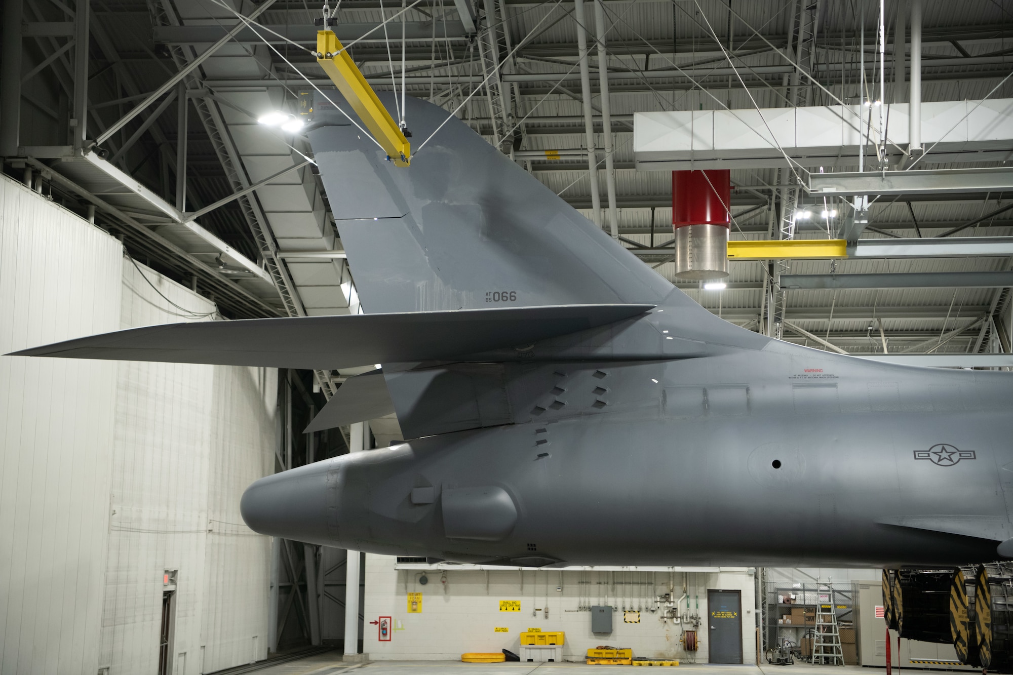 Marks identifying a B-1B Lancer as assigned to Ellsworth Air Force Base, S.D., are removed at the base Feb. 16, 2021, prior to the aircraft’s divestiture. Divesting aircraft with the least amount of usable life allows Air Force Global Strike Command to prioritize the health of the fleet and crew training. The ability to balance these priorities will make the current bomber fleet more capable overall and give it more capacity. (U.S. Air Force photo by Airman Jonah Fronk)