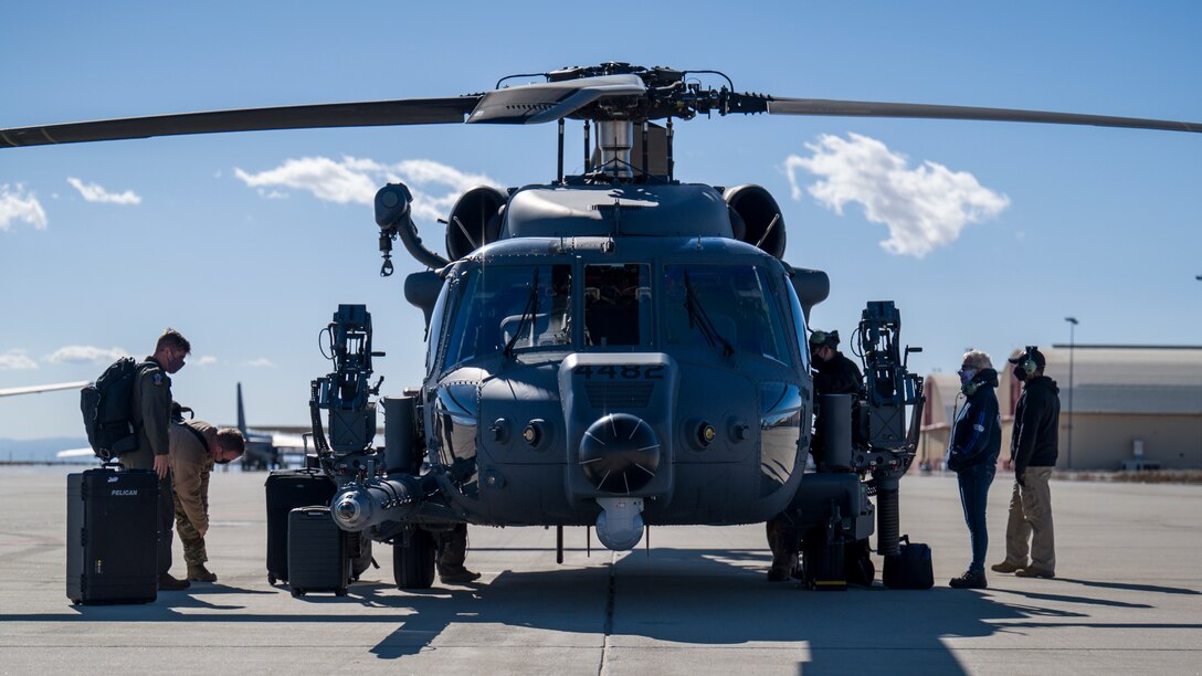 Crews off-load from two HH-60W “Jolly Green II” combat rescue helicopters at Edwards Air Force Base, California, Feb. 17. The HH-60Ws arrived from Eglin AFB, Florida, to conduct flight test operations. (Air Force photo by Giancarlo Casem)
