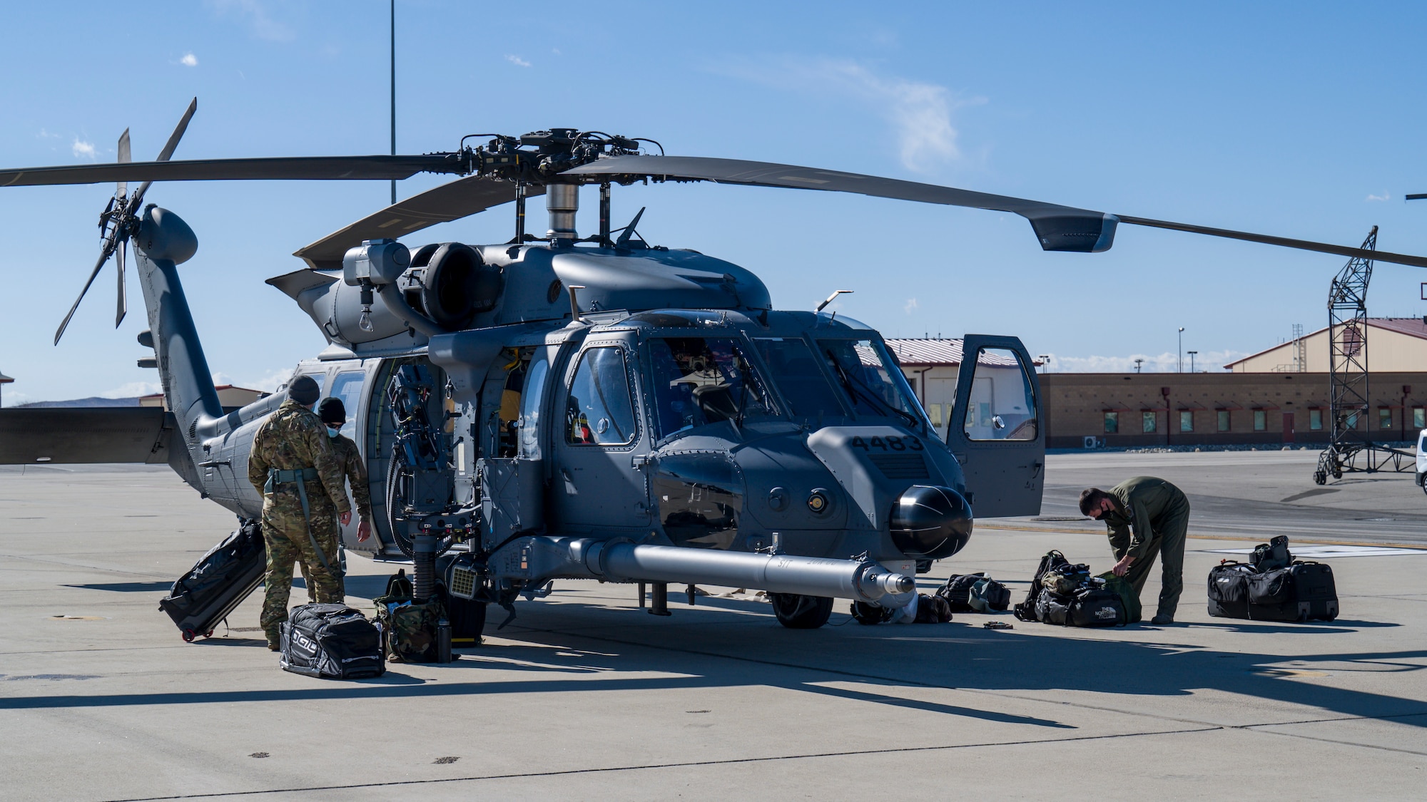 Crews off-load from two HH-60W “Jolly Green II” combat rescue helicopters at Edwards Air Force Base, California, Feb. 17. The HH-60Ws arrived from Eglin AFB, Florida, to conduct flight test operations. (Air Force photo by Giancarlo Casem)