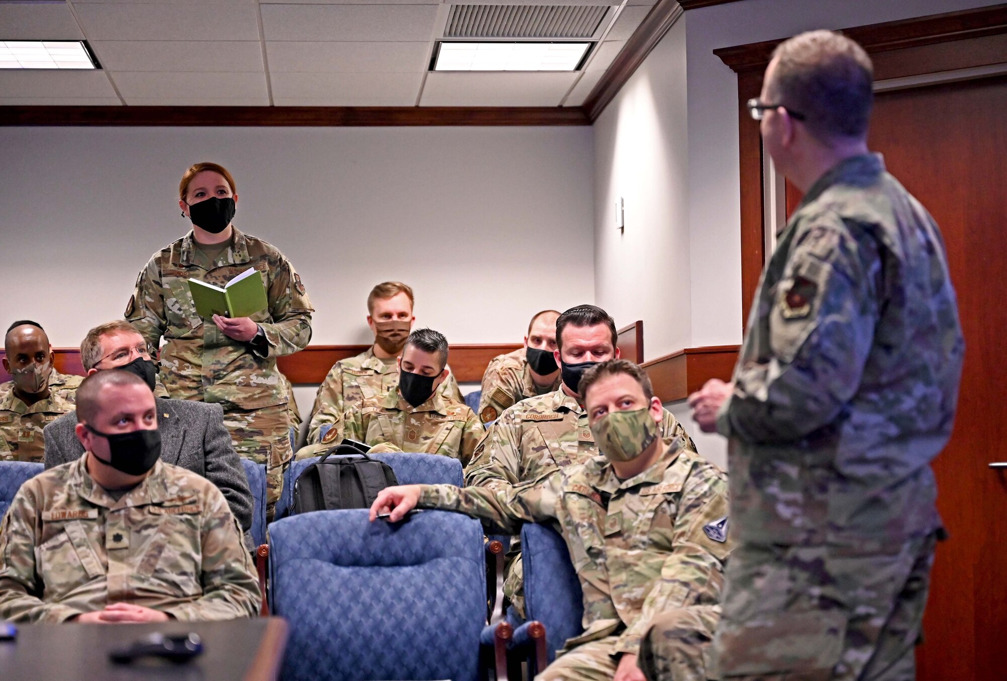 An Air Force Special Operations Command Airman poses a question to U.S. Air Force Lt. Gen. Jim Slife, commander of AFSOC, during the command's Mission Defense Conference at Hurlburt Field, Fla., Feb. 2, 2021. The conference focused on identifying the organic cyber capabilities needed to protect missions against threats in, through, and from cyberspace. (U.S. Air Force photo by Senior Airman Brandon Esau)