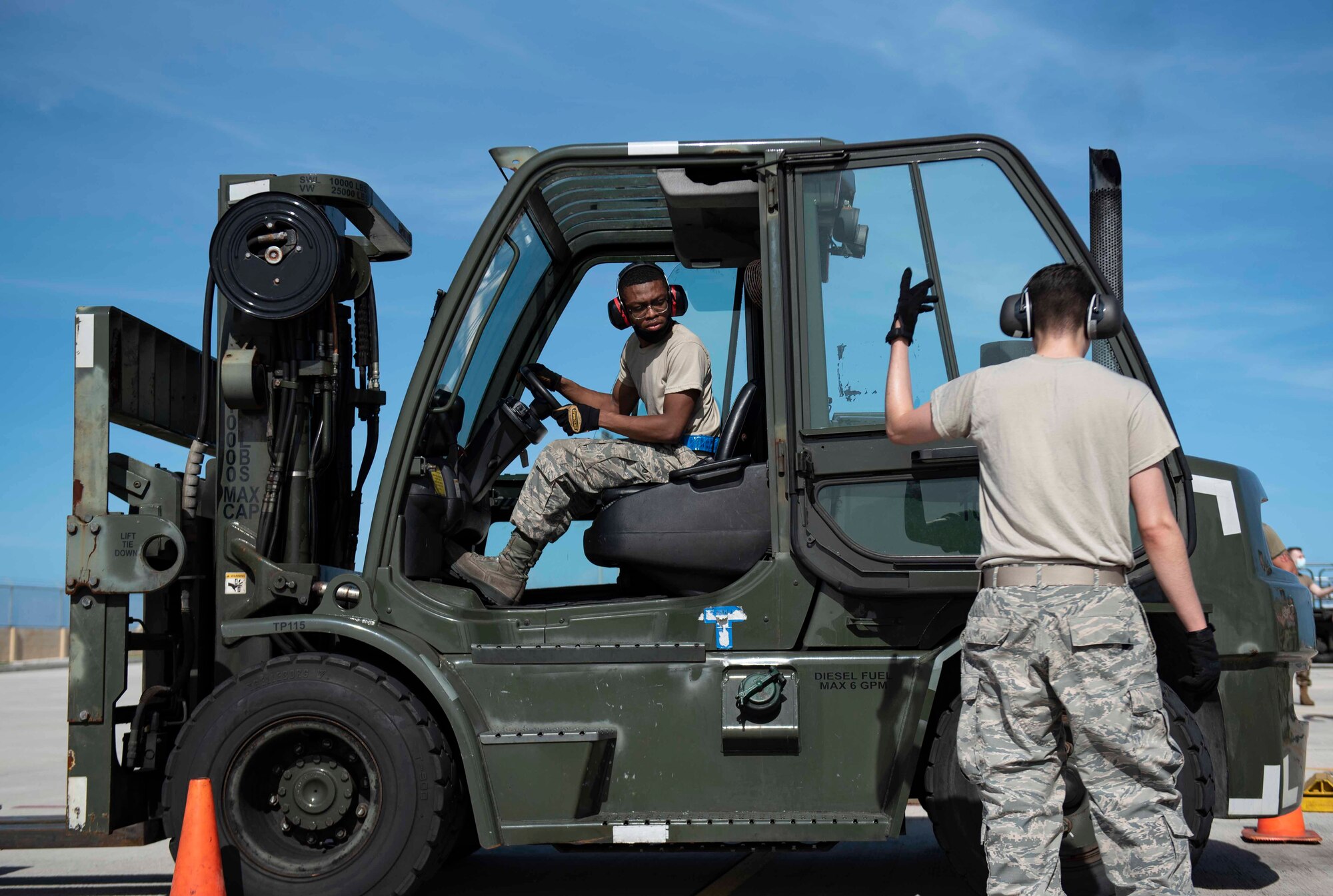 An Airman from the Air Mobility Operations Wing operates a forklift through the event course for the Port Dawg Rodeo at Andersen Air Force Base, Guam, Feb. 11, 2021.