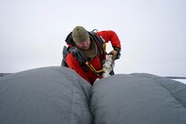 212th Rescue Squadron marks change of command with unique Alaska backdrop