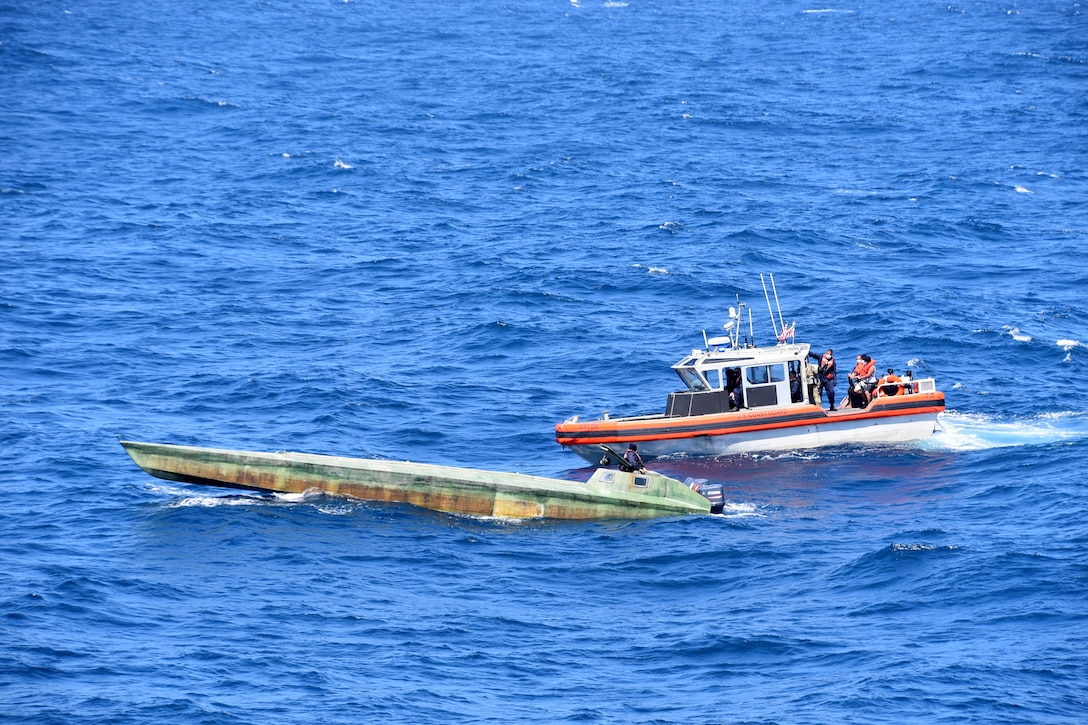 Coast Guard Cutter Bertholf (WMSL 750) boarding teams interdict a low-profile vessel in the Eastern Pacific Ocean, seizing more than 4,380 pounds of cocaine, Feb. 1, 2021.