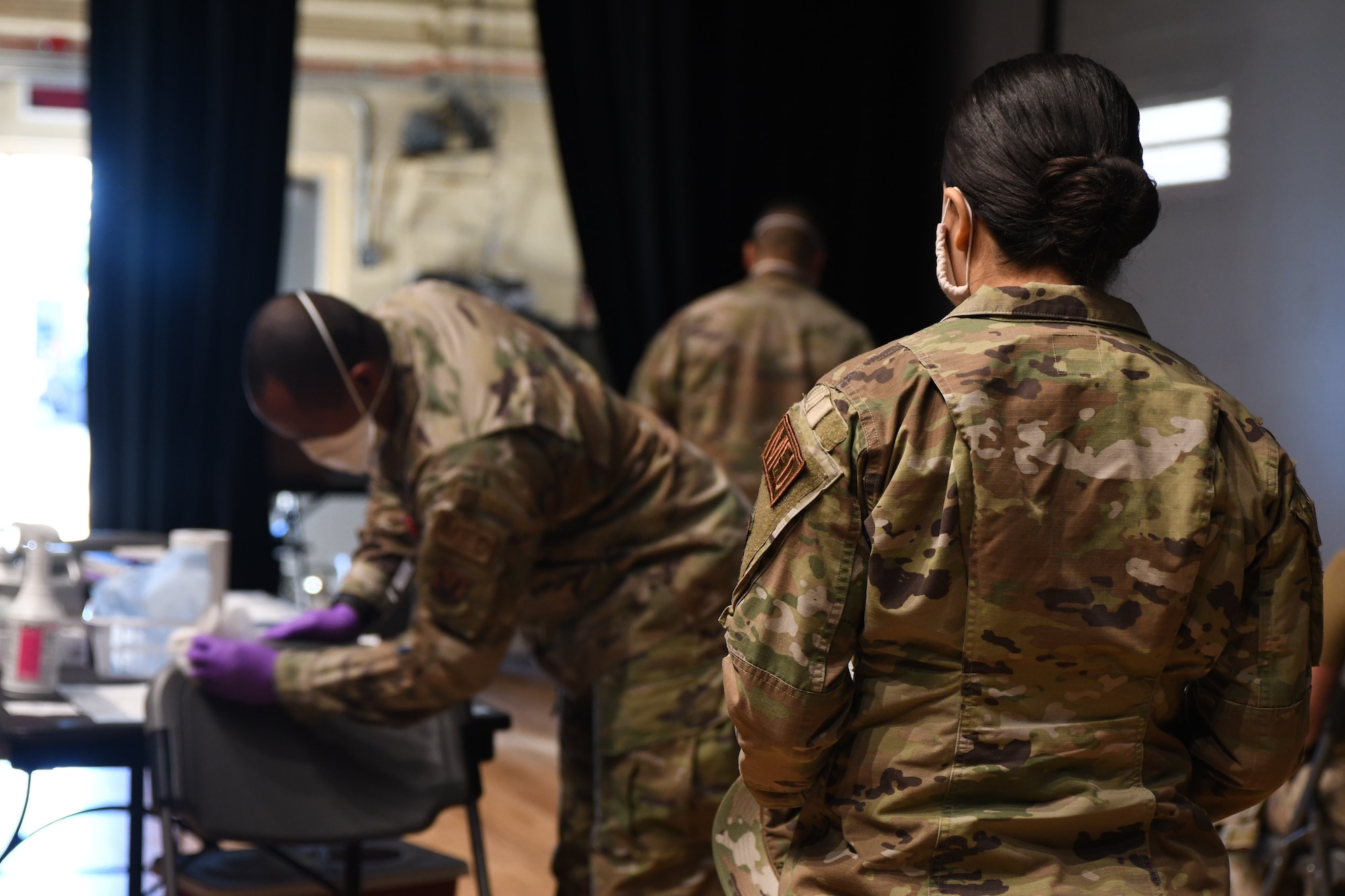 A 355th Medical Group Airman sanitizes a vaccination station at Davis-Monthan Air Force Base, Arizona, Feb. 5, 2021.