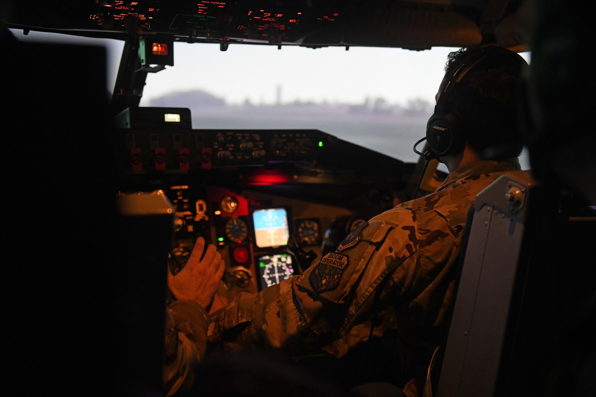 U.S. Air Force Senior Airman Juan Morales, 351st Air Refueling Squadron boom operator, prepares for take-off in the KC-135 Stratotanker aircraft flight simulator during the Tanker Heist competition at Royal Air Force Mildenhall, England, Feb. 11, 2021. Tanker Heist focused on pushing the boundaries of aircrew knowledge and proficiency, while ensuring aircrew members are able to communicate and instruct one another effectively. (U.S. Air Force photo by Staff Sgt. Mackenzie Mendez)