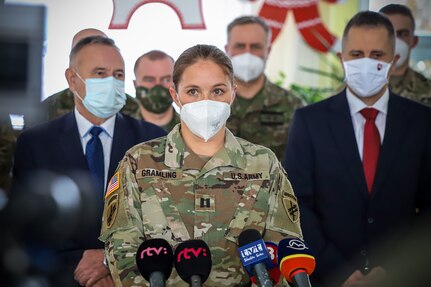 Capt. Madeline Gramling, 3232nd Civil Affairs Team commander, addresses the crowd during a ceremony in Martin, Slovakia, on February 12, 2021. Soldiers from the 432nd Civil Affairs Battalion along with their counterparts in the Slovak military gifted ozone generators to a school in Martin. Two-hundred and forty-five generators, supplied by a Slovak company, were presented to Aurel Stodola Elementary School to be used in the classrooms throughout the district. The donation is to increase the safety of children and young people studying in primary schools through effective and regular disinfection of school classrooms and common areas in schools to combat the spread of COVID-19.