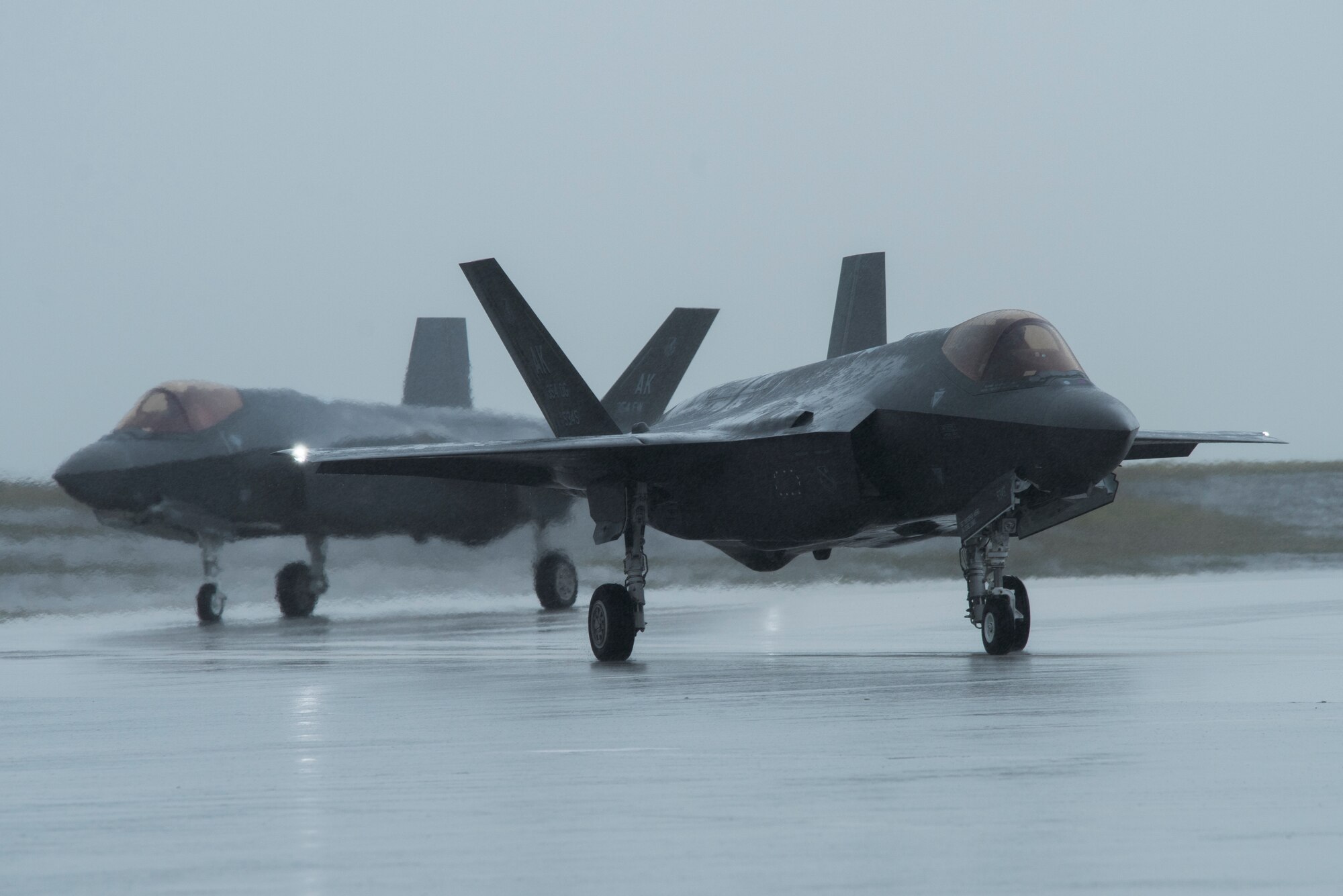 Two U.S. Air Force F-35A Lightning II assigned to Eielson Air Force Base, Alaska, taxi on the flightline as part of Cope North 21 at Andersen AFB, Guam, Feb. 6, 2021. Cope North 21 is an annual multinational exercise designed to improve interoperability and readiness among participating partner nations, and this is the first iteration of Cope North to have F-35A participation. (U.S. Air Force photo by Senior Airman Jonathan Valdes Montijo)