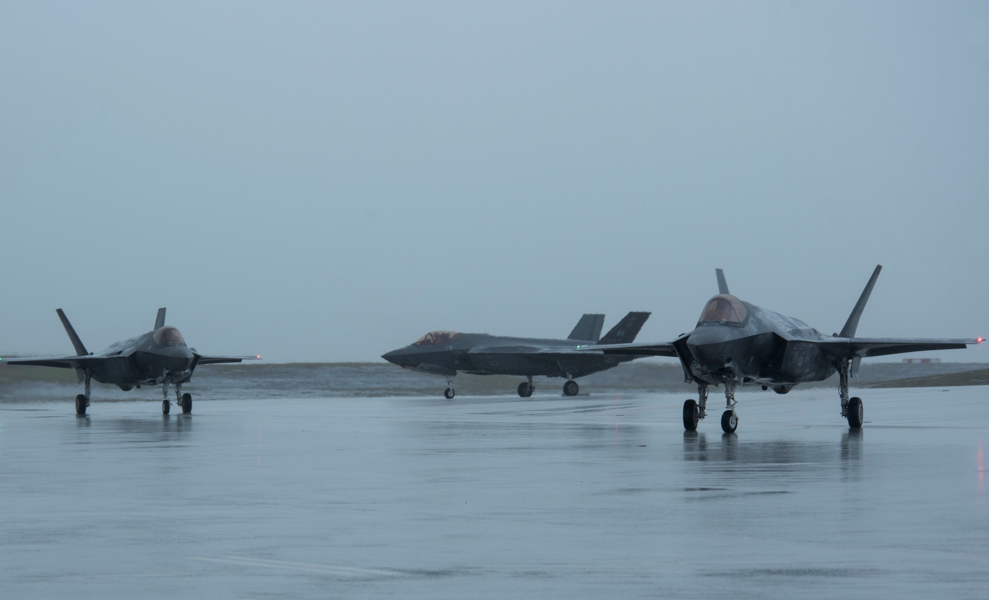 Three U.S. Air Force F-35A Lightning II assigned to Eielson Air Force Base, Alaska, taxi on the flightline as part of Cope North 21 at Andersen AFB, Guam, Feb. 6, 2021. The mission of the exercise is to focus on coordination of combined air tactics, techniques and procedures, and enhancing security and stability in the Indo-Pacific region. (U.S. Air Force photo by Senior Airman Jonathan Valdes Montijo)