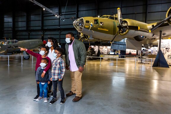 Family in front of the B-17 Memphis Belle in the World War II Gallery. (Photo by Matthew Allen)