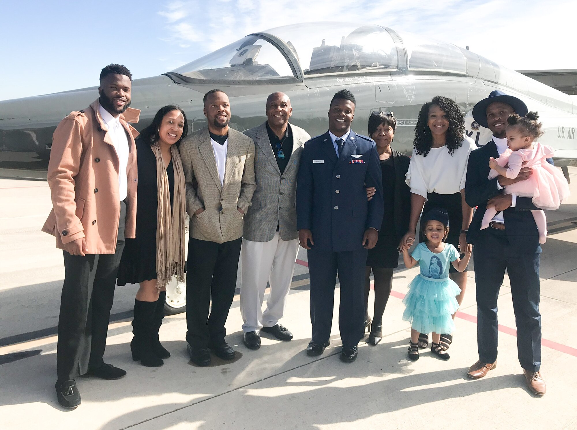 1st Lt. Bryan Driskell (center), an AC-130W Stinger II aircraft pilot with the 16th Special Operations Squadron, at the time a 2nd lieutenant, poses with his family for a photo at his pilot school graduation at Laughlin Air Force Base, Texas. When Driskell went to the Air Force Academy, he decided to become a pilot after attending an optional flying course during his sophomore year. (Courtesy Photo)
