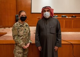 Cpt. Emrick Whitfield, veterinary clinic officer in charge, Area Support Group Kuwait, poses with the General Director for the Public Authority of Agriculture Affairs and Fish Resources, Mohamed Alsabah, after a canine behavior and safety seminar in Rabia, Kuwait, Feb. 2, 2021. The seminar was hosted by the Kuwaiti Public Authority of Agriculture Affairs and Fish Resources and conducted by Whitfield.