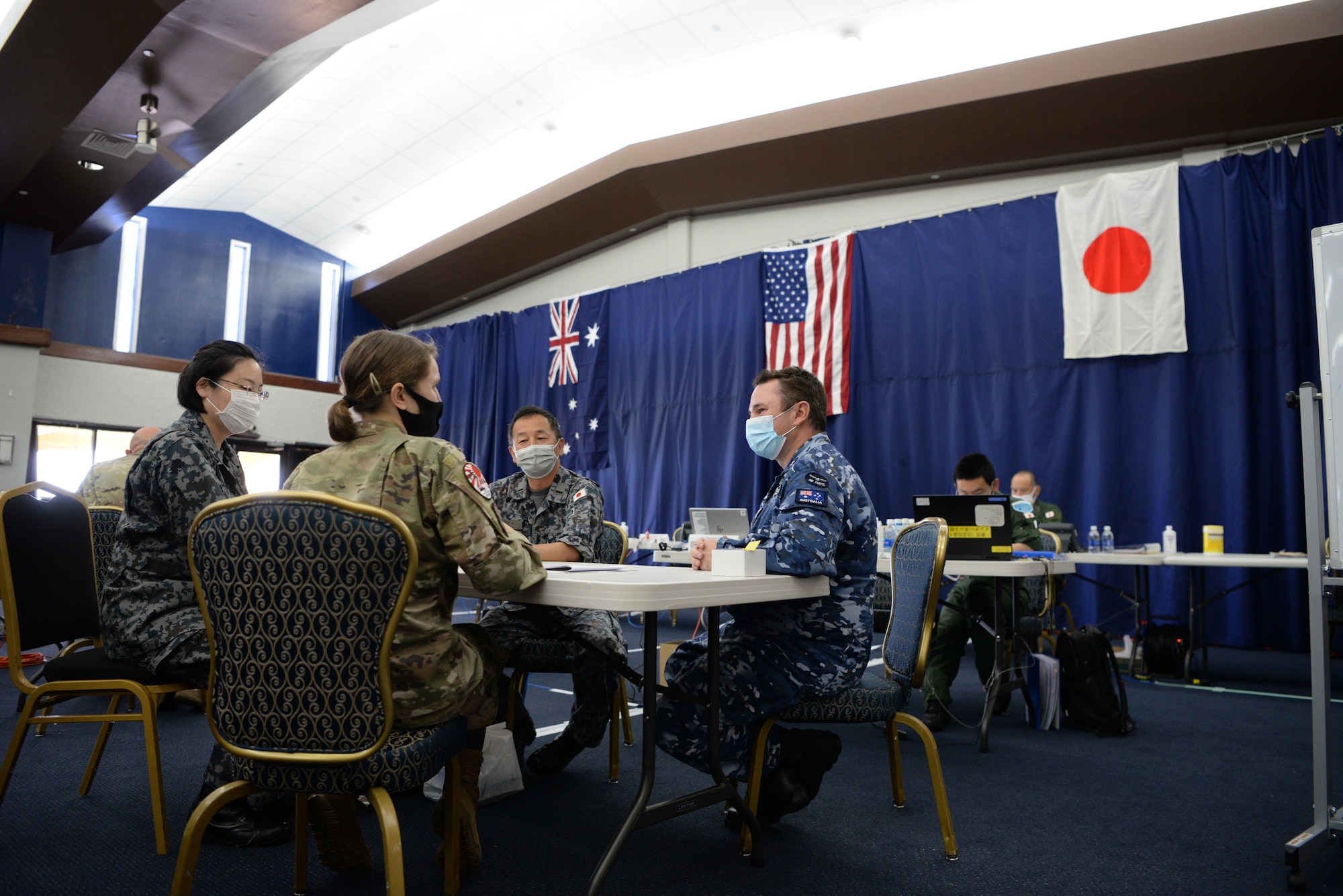 U.S. Air Force Maj. Brittany Morreale, the 5th Air Force A5 division chief and Cope North 21 Interpreter Cell lead, serves as an interpreter for a Japan Air Self-Defense Force, or Koku-Jieitai, and a Royal Australian Air Force member during Cope North 21 at Andersen Air Force Base, Guam,