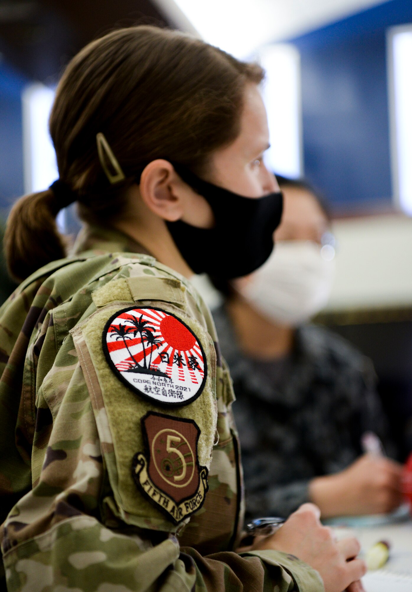 U.S. Air Force Maj. Brittany Morreale serves as an interpreter for a Japan Air Self-Defense Force, or Koku-Jieitai, and a Royal Australian Air Force member during Cope North 21