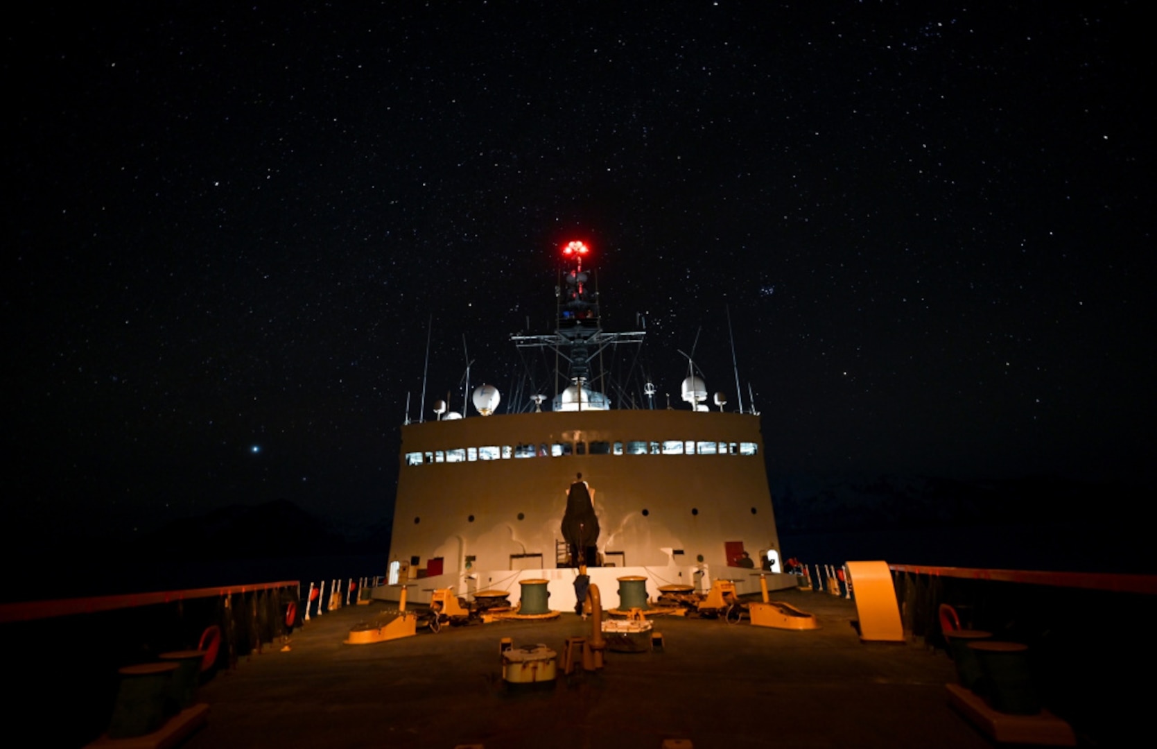 The view from aboard the Coast Guard Cutter Polar Star (WAGB 10) while the cutter is at anchor in Taylor Bay, Alaska, Thursday, February 11, 2021. The 45-year-old heavy icebreaker is nearing the end of a months-long patrol to project power and support national security objectives throughout Alaskan waters and into the Arctic.