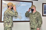 YOKOSUKA, Japan (Feb. 15, 2021) - Outgoing Commanding Officer Capt. Craig Sicola, from Dallas, and newly appointed Commanding Officer Capt. Tim Waits, from Anniston, Alabama, exchange salutes during a change of command ceremony held in the admiral’s cabin aboard U.S. 7th Fleet flagship USS Blue Ridge. Blue Ridge is the oldest operational ship in the Navy and, as 7th Fleet command ship, actively works to foster relationships with allies and partners in the Indo-Pacific Region. (U.S. Navy photo by Mass Communication Specialist 3rd Class Matt Hall)