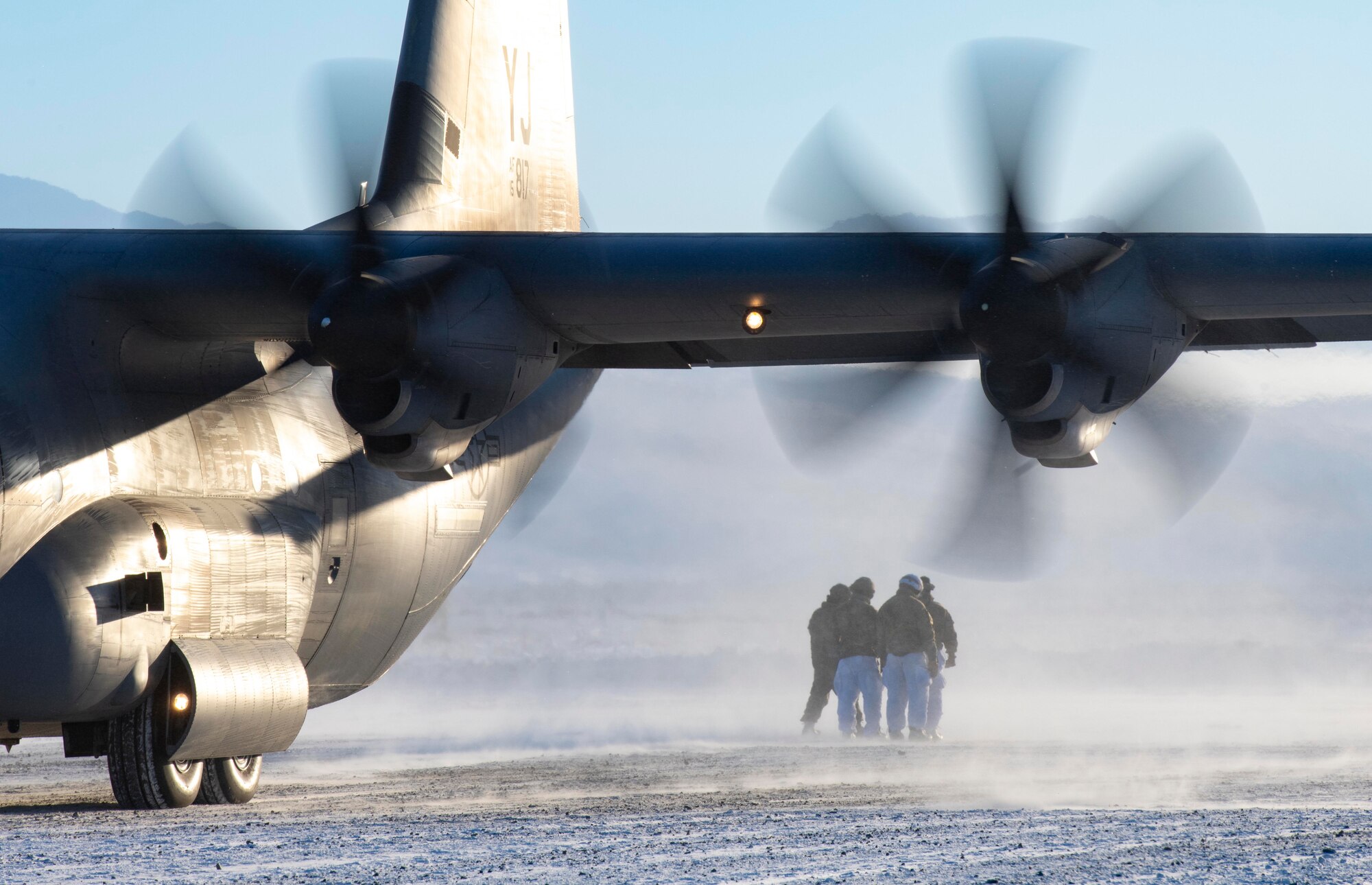 U.S. Army paratroopers, assigned to the 4th Infantry Brigade Combat Team (Airborne), 25th Infantry Division (Spartan Brigade), approach a C-130J Super Hercules, assigned to the 36th Airlift Squadron, Yokota Air Base, Japan, during exercise Arctic Warrior 21 at Donnelly Training Area, AK, Feb. 8, 2021