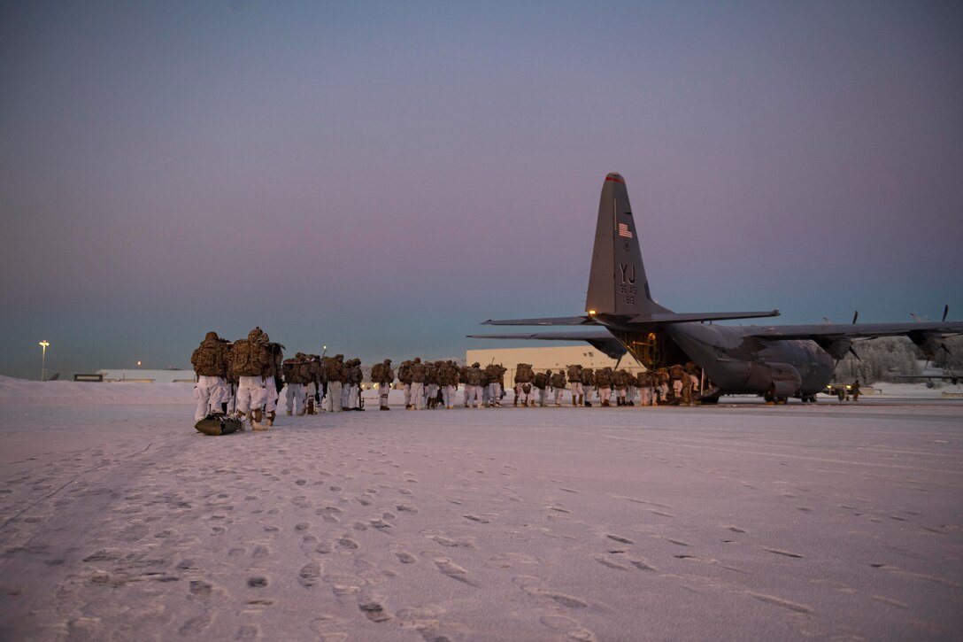 U.S. Army paratroopers, assigned to the 4th Infantry Brigade Combat Team (Airborne), 25th Infantry Division (Spartan Brigade), board a C-130J Super Hercules, assigned to the 36th Airlift Squadron, Yokota Air Base, Japan, during exercise Arctic Warrior 21 at Joint Base Elmendorf-Richardson, AK, Feb. 8, 2021