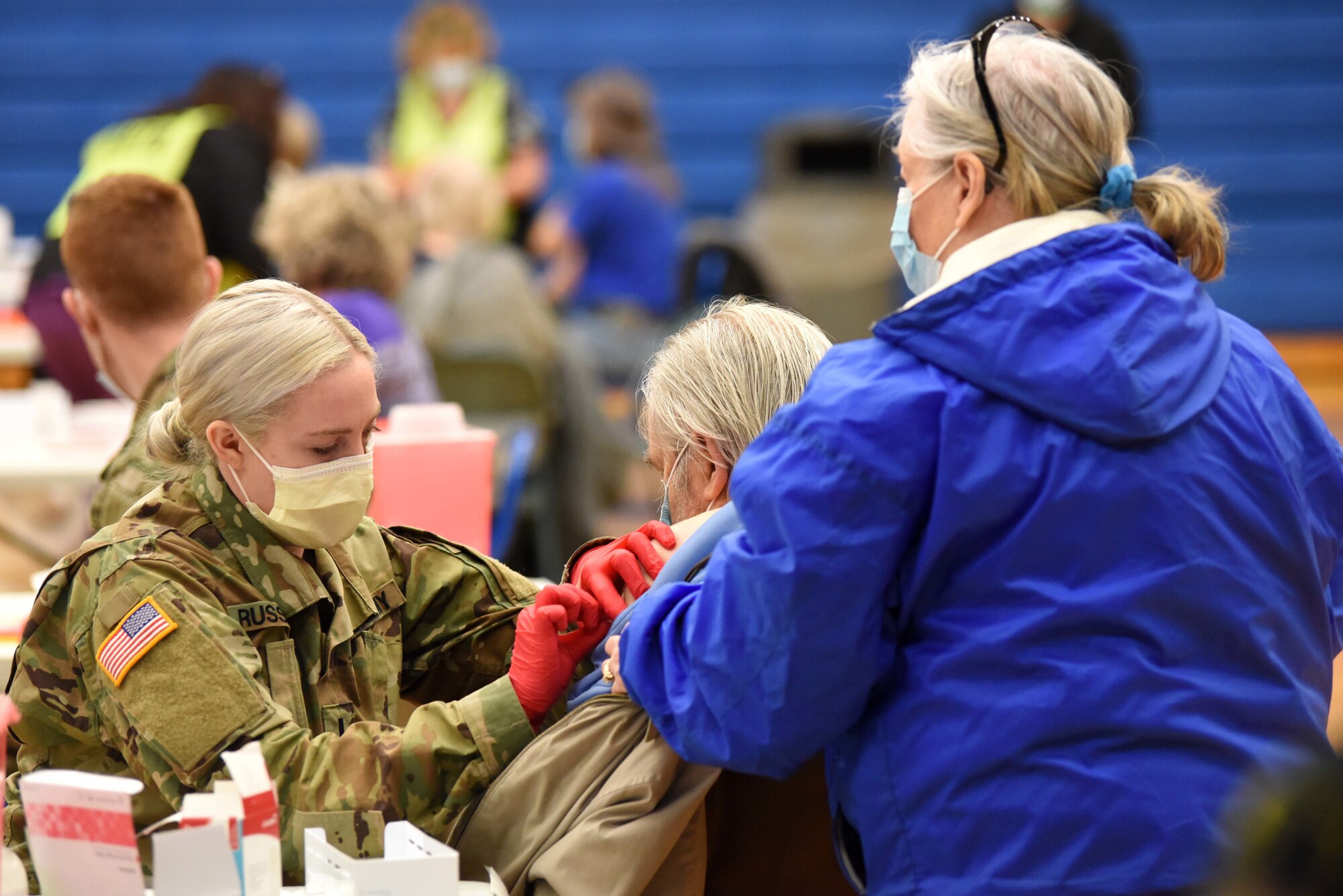 A Michigan Army National Guard Soldier administers a COVID-19 vaccine in Centerville, Michigan, Feb. 17, 2021. The Michigan Department of Health and Human Services and Michigan National Guard have been working throughout the pandemic to increase access to vaccinations across the state.