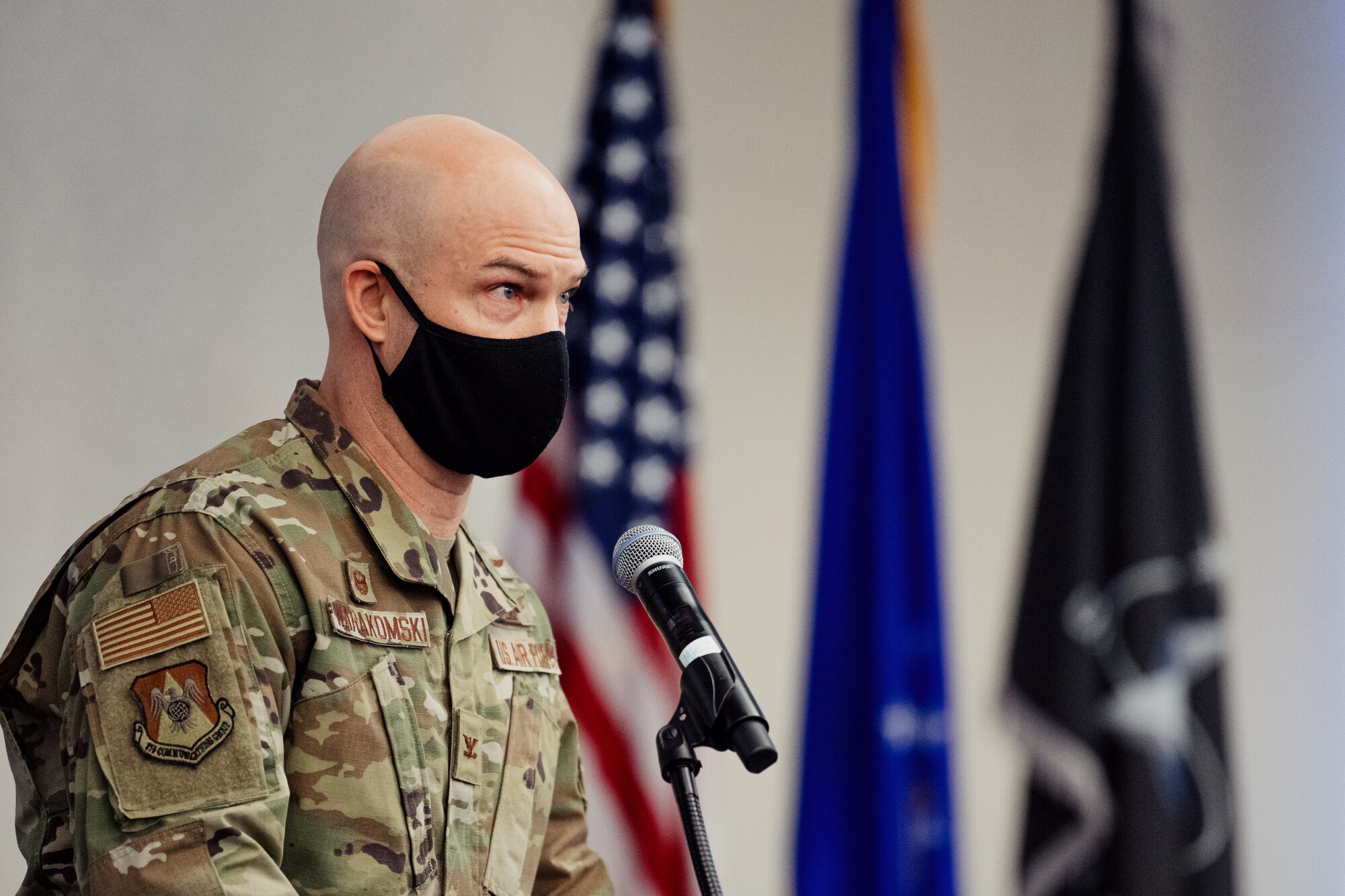 man speaking at ceremony