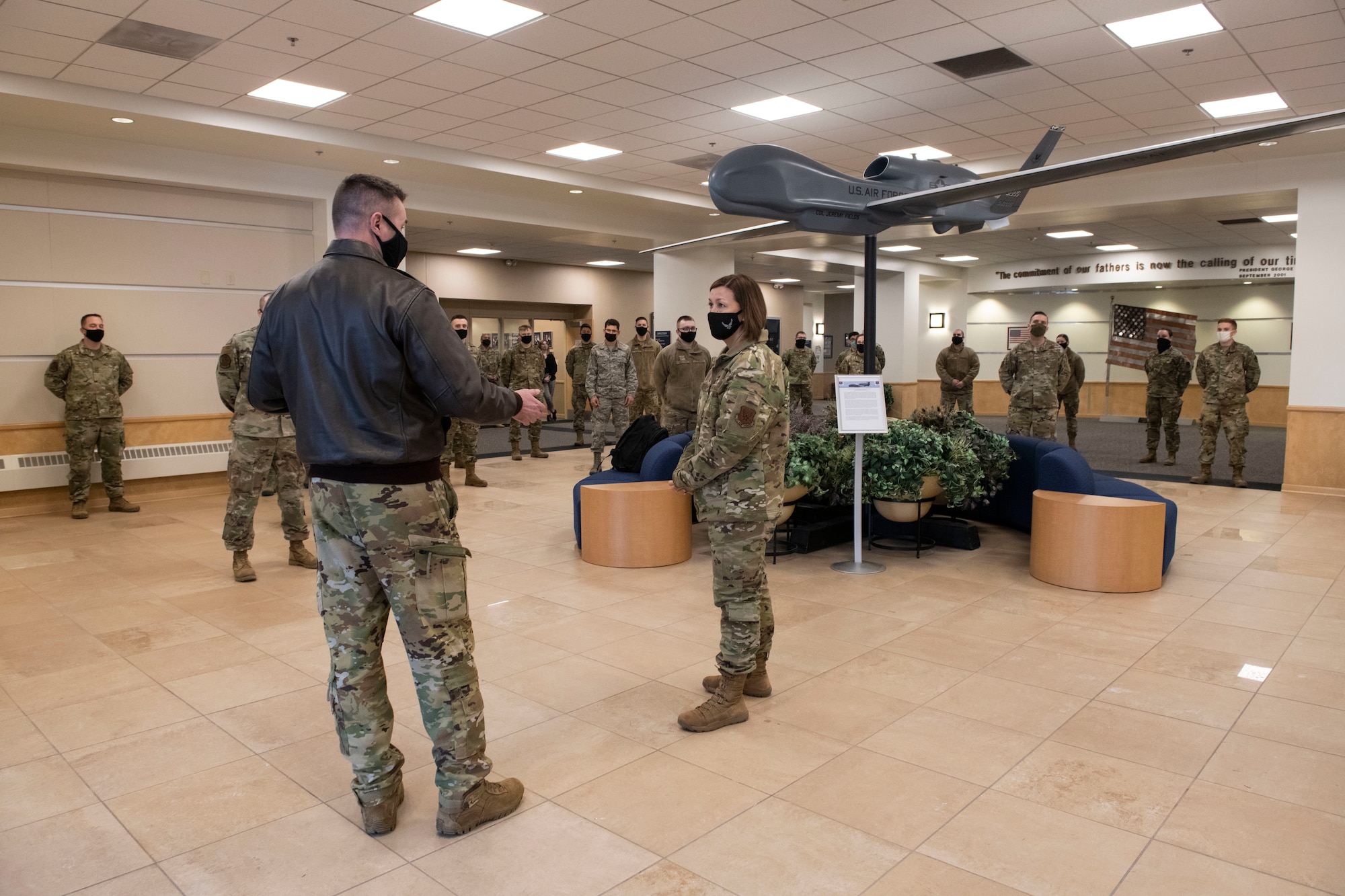 Chief Master Sgt. of the Air Force JoAnne S. Bass is welcomed by Chief Master Sgt. Kevin Swann, 319th Operations Group superintendent, at Grand Forks Air Force Base, N.D., Feb. 11, 2021. Bass visited to discuss her priorities, Air Force policies, and address the questions and concerns of Airmen.