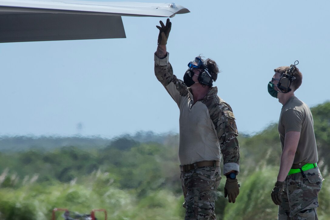 U.S. Air Force Airmen go over safety procedures on an F-35A Lightning II assigned to Eielson Air Force Base, Alaska, at Northwest Field as part of Agile Combat Employment (ACE) multi-capable Airmen training during Cope North 21 at Andersen AFB, Guam, Feb. 16, 2021.