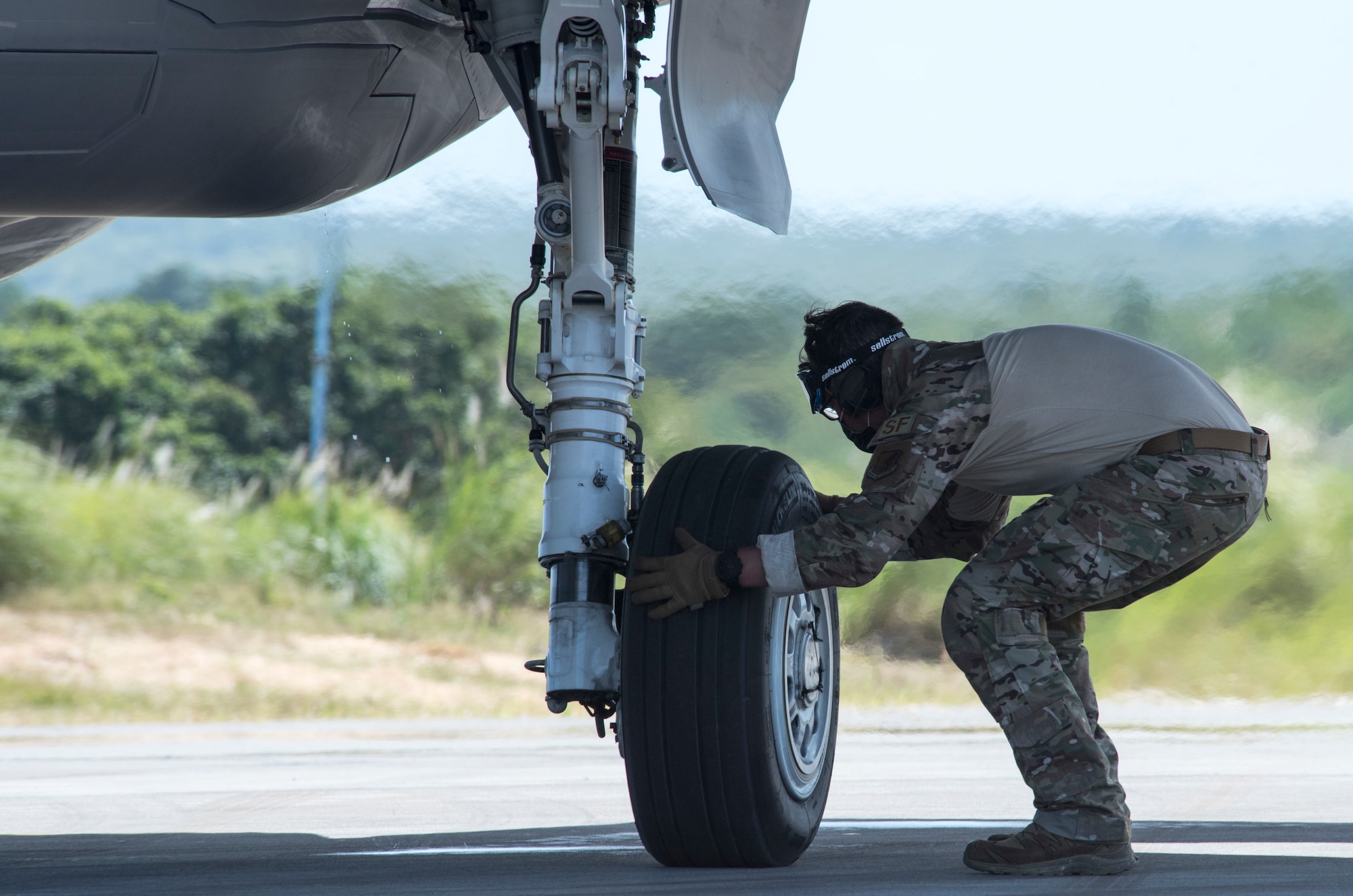 A U.S. Air Force Airman goes over safety procedures on an F-35A Lightning II assigned to Eielson Air Force Base, Alaska, at Northwest Field as part of Agile Combat Employment (ACE) multi-capable Airmen training during Cope North 21 at Andersen AFB, Guam, Feb. 16, 2021.