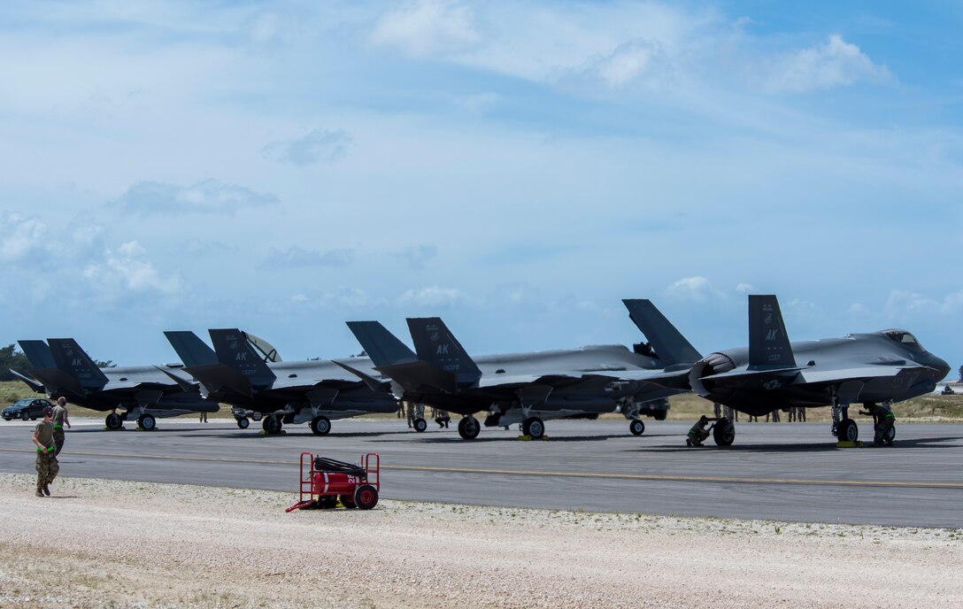 Four F-35A Lightning II assigned to Eielson Air Force Base, Alaska, sit at Northwest Field after participating in hot-pit refueling as part of Agile Combat Employment (ACE) multi-capable Airmen training during Cope North 21 at Andersen AFB, Guam, Feb. 16, 2021.