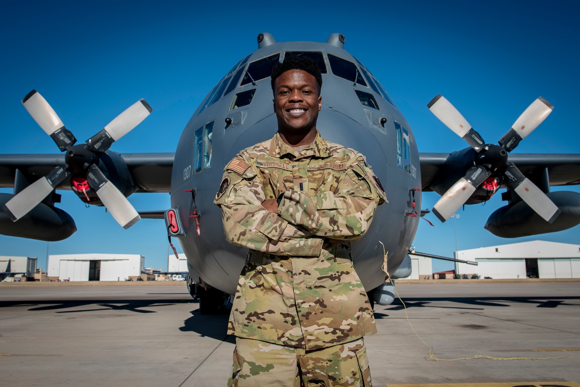 1st Lt. Bryan Driskell, an AC-130W Stinger II aircraft pilot with the 16th Special Operations Squadron, stands in front of his assigned aircraft at Cannon Air Force Base, N.M., Jan. 27, 2021. Driskell had decided to become a pilot after taking a flying class during his sophomore year at the Air Force Academy. (U.S. Air Force photo by Senior Airman Vernon R. Walter III)