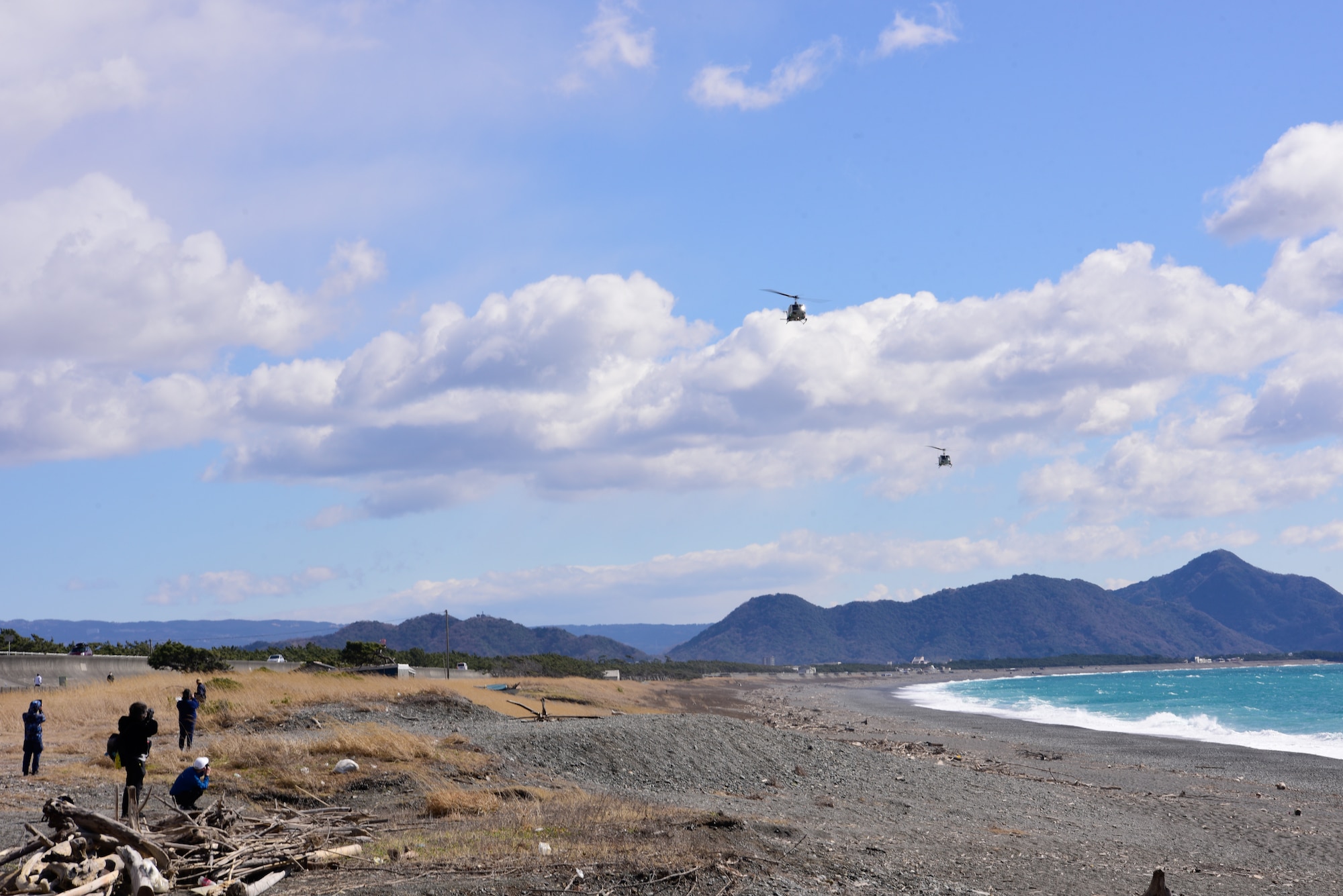 Two UH1N Helicopters fly over Numazu Beach