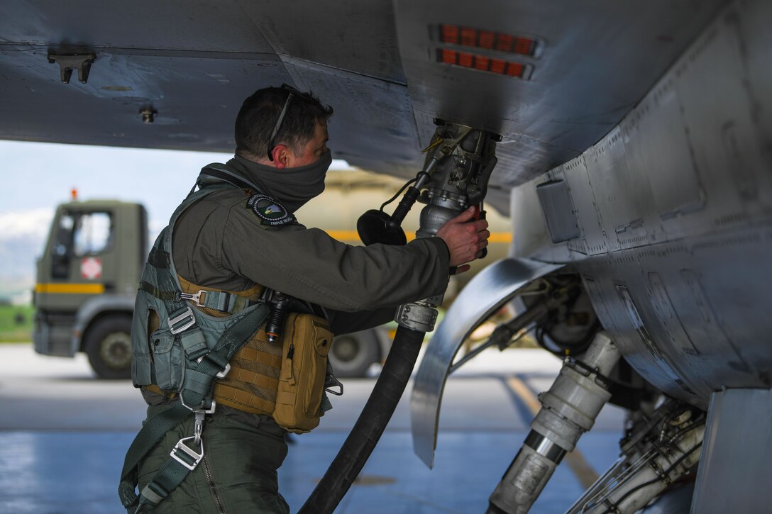 U.S. Air Force Maj. Mike Rogers, 555th Fighter Squadron pilot, refuels an F-16 Fighting Falcon during an Agile Combat Employment exercise at Amendola Air Base, Italy, Feb. 16, 2021. The exercise was designed to provide aircrew and support personnel the experience needed to maintain a ready force. (U.S. Air Force photo by Senior Airman Ericka A. Woolever)