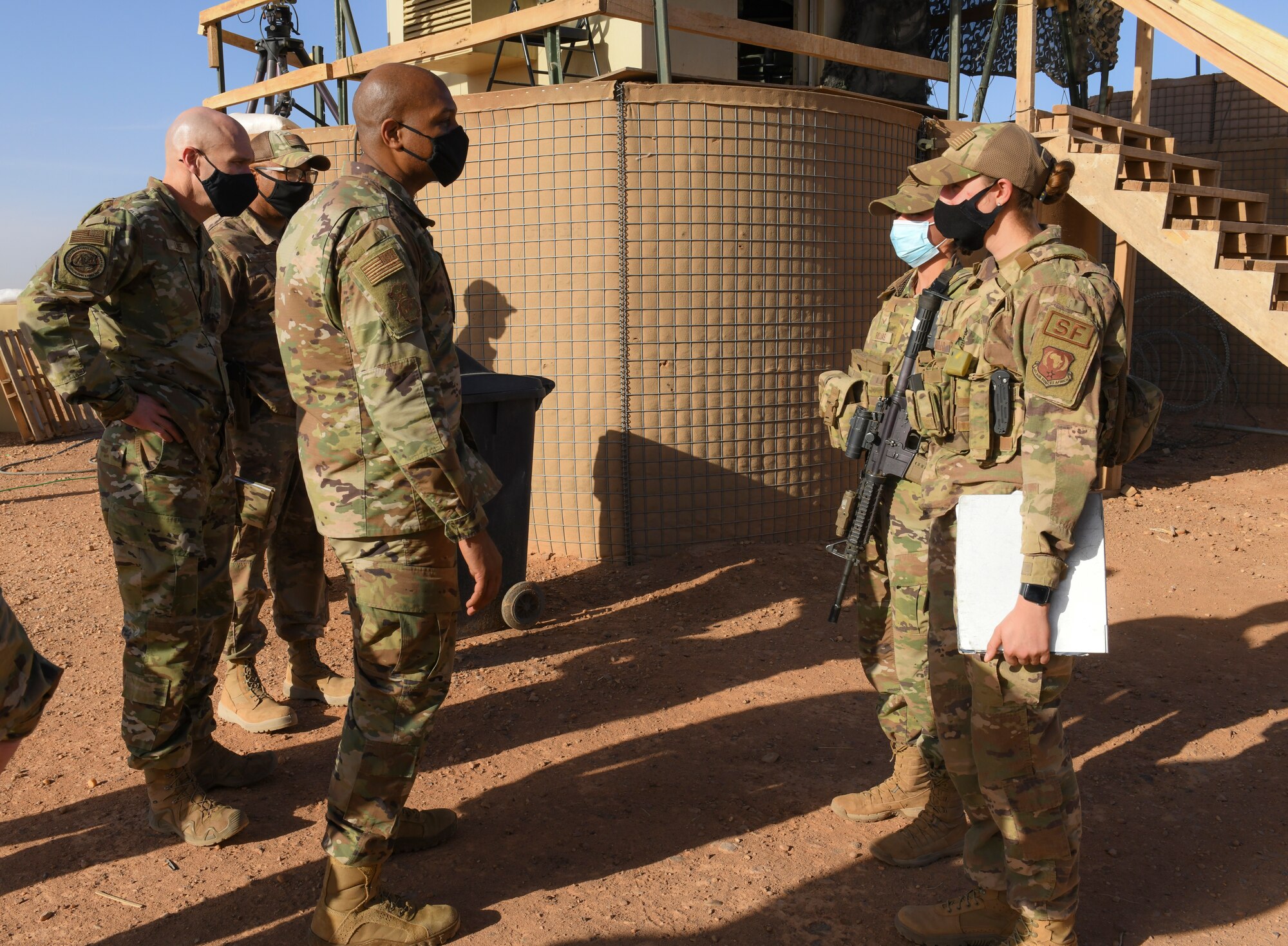 U.S. Air Force Brig. Gen. Roy W. Collins, Headquarters U.S. Air Force director of security forces and deputy chief of staff for logistics, engineering and force protection, speak with 409th Expeditionary Security Forces Squadron members during a visit to Nigerien Air Base 201, Agadez, Niger, Feb. 6, 2021. The 409 ESFS and the French Armees Nigeriennes work together to defend the base and its assets. (U.S. Air Force photo by Senior Airman Gabrielle Winn)