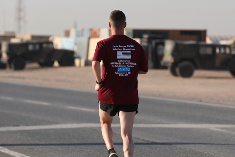 U.S. Army Capt. Matthew Stern, logistics officer with Headquarters Support Company, 628th Aviation Support Battalion, 28th Expeditionary Combat Aviation Brigade, runs during the Task Force Anvil Marathon. About 120 Soldiers raced in memory of Michael J. Novosel, Sr., a native of Etna, Pennsylvania, who served for over 40 years as an Army aviator and received the Medal of Honor for rescuing 29 Soldiers during the Vietnam War.