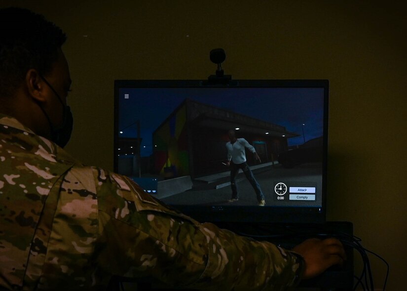 U.S. Air Force Staff Sgt. David Griffin, 633rd Security Forces Squadron Non-Commissioned Officer In-Charge of training, controls virtual reality training to test defenders’ reactions in different use-of-force scenarios Feb. 3, 2021, at Joint Base Langley-Eustis, Virginia.