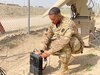 Spc. John Pack, deployed with the 1st Battalion, 137th Aviation Regiment, performs a radio check after setting up telecommunication equipment.  Spc. Pack is currently deployed in support of Operation INHERENT RESOLVE and Operation SPARTAN SHIELD.