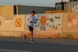 U.S. Army 1st Sgt. Gregory Chuhran, senior enlisted leader of Headquarters and Headquarters Company, 2-104th General Support Aviation Battalion, 28th Expeditionary Combat Aviation Brigade, runs during the Task Force Anvil Marathon. About 120 Soldiers raced in memory of Michael J. Novosel, Sr., a native of Etna, Pennsylvania, who served for over 40 years as an Army aviator and received the Medal of Honor for rescuing 29 Soldiers during the Vietnam War.